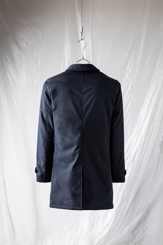 Technical coat with heat-sealed padding and color-matched buttons