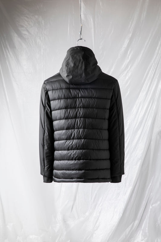 Quilted bi-material jacket with fixed hood