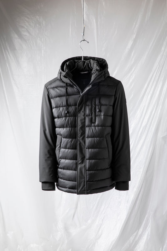 Quilted bi-material jacket with fixed hood